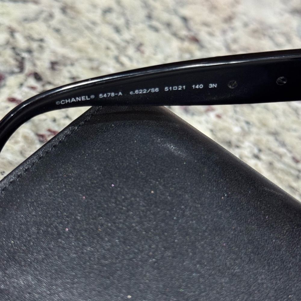 CHANEL Black and Gold Sunglasses with Signature Embellishments - Picture 4 of 5